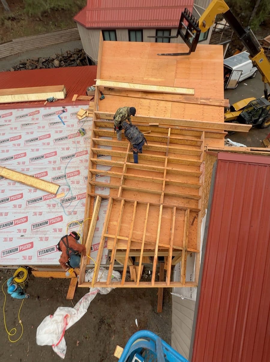 Antova crew framing a roof during a rebuild